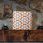 Orange Blue Cream Geometric Hexagons Pattern Tile<br><div class="desc">This ceramic tile features a captivating geometric pattern composed of star-shaped motifs surrounded by an array of triangles and other polygons, creating a kaleidoscopic effect. The colour palette is a striking combination of soft orange, deep navy blue, and white hues, which together create an eye-catching contrast. Each element within the...</div>