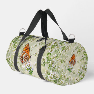 Orange Butterfly on Delicate White Flowers Duffle Bag