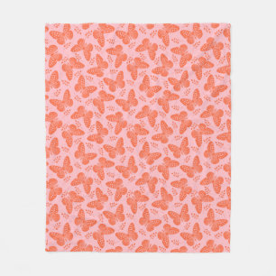 Orange butterfly pattern on pink background fleece blanket