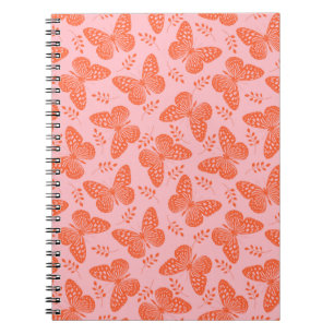 Orange butterfly pattern on pink background notebook