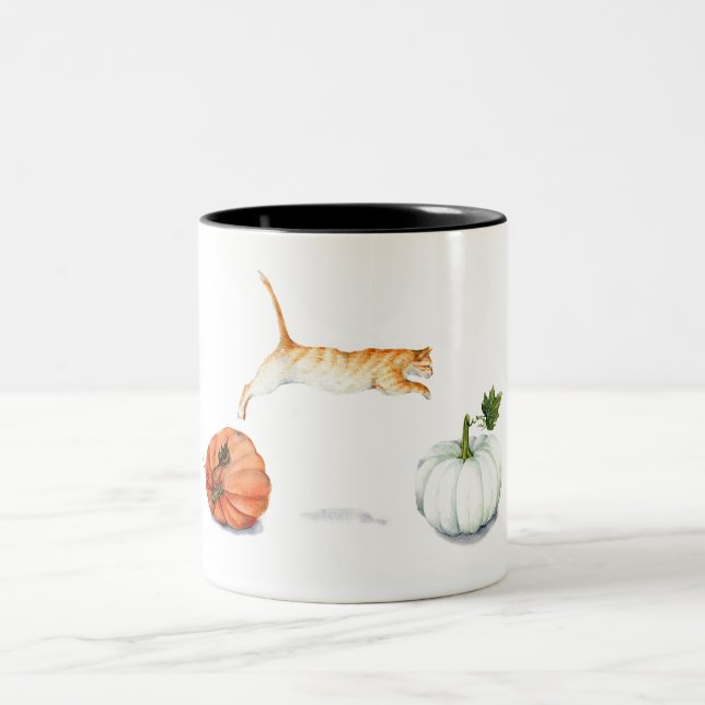 Orange Cat Jumping Between Pumpkins Two-Tone Coffee Mug (Center)