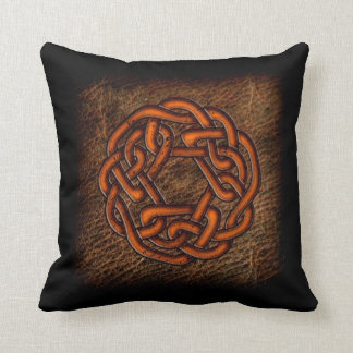 Orange celtic knot on leather cushion
