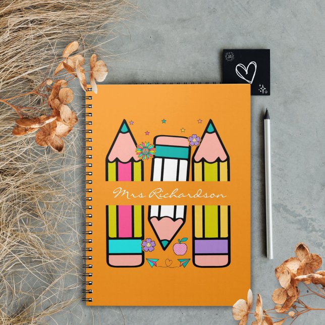 Orange Colourful teacher name pencil cartoon  Notebook (Creator Uploaded)