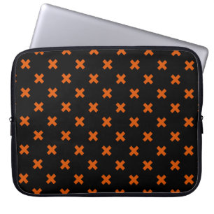 Orange cross stitches on black laptop sleeve