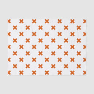 Orange cross stitches on white tissue paper