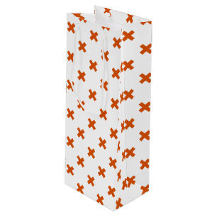 Orange cross stitches on white wine gift bag