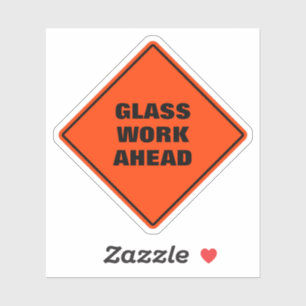 Orange diamond road sign glass work ahead