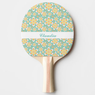 Orange flowers on green ping pong paddle