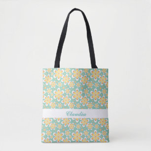 Orange flowers on green tote bag