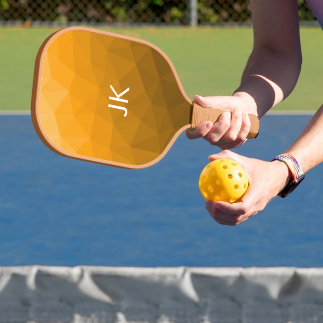 Orange gradient geometric mesh pattern pickleball paddle (Insitu)