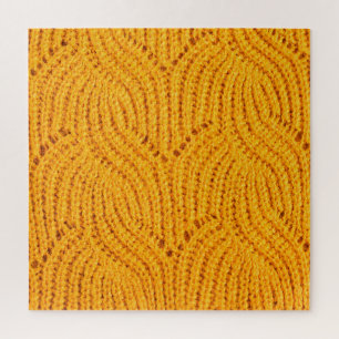 Orange knitted sweater, textured background. jigsaw puzzle