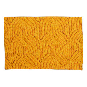 Orange knitted sweater, textured background. pillowcase