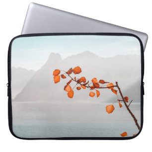 ORANGE LEAF NEAR BODY OF WATER AND MOUNTAINS LAPTOP SLEEVE