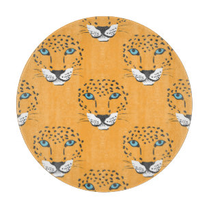 Orange leopard head, seamless pattern. cutting board