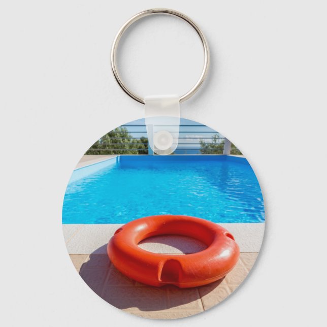 Orange life buoy at blue swimming pool key ring (Front)