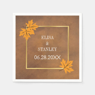 Orange maple leaves on brown rustic wedding napkin