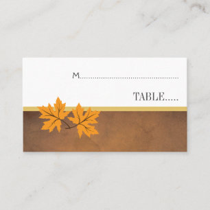 Orange maple leaves on brown wedding escort card