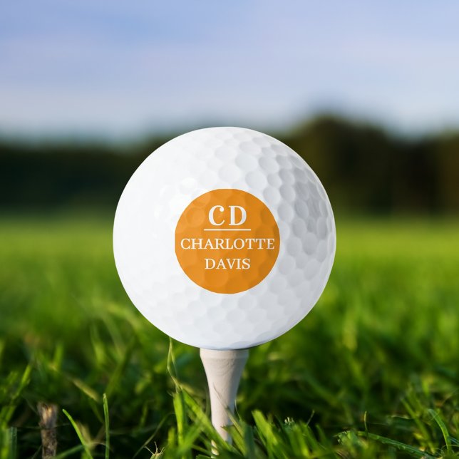 Orange monogram name golf balls (Creator Uploaded)