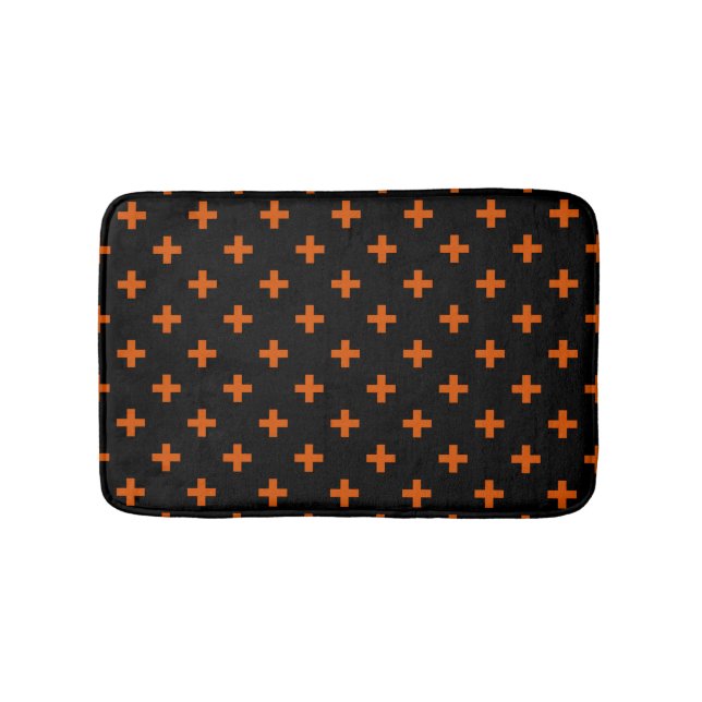 Orange polka crosses on black bath mat (Front)