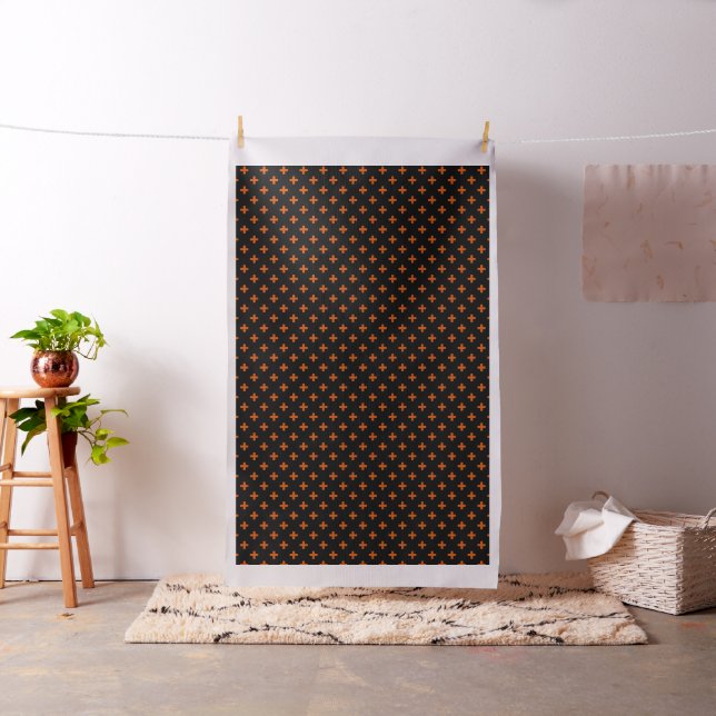 Orange polka crosses on black fabric (In Situ)