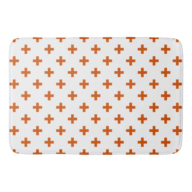 Orange polka crosses on white bath mat (Front)