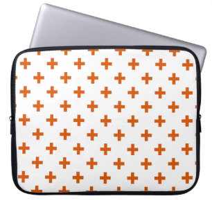 Orange polka crosses on white laptop sleeve