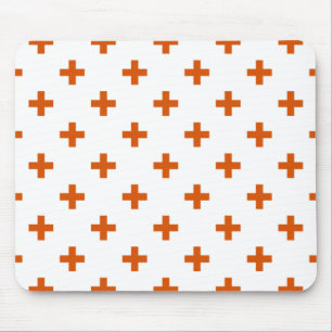 Orange polka crosses on white mouse pad