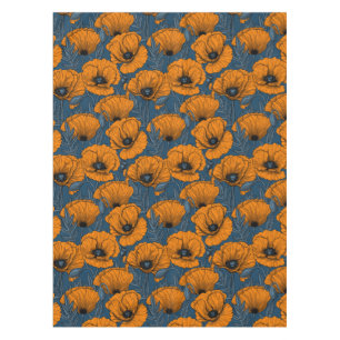 Orange poppies on dark blue tablecloth