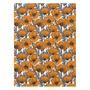 Orange poppies on white tablecloth