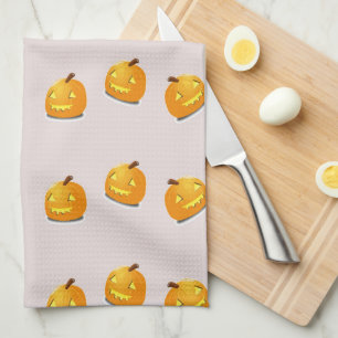 Orange pumpkin head pattern tea towel
