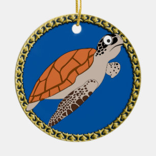 Orange sea turtle swimming with a gold frame ceramic tree decoration