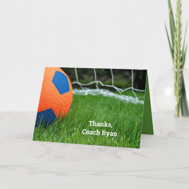 Orange soccer ball on grass card (Front)