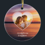 Orange Sunset Heart Couple Photo And Names Ceramic Tree Decoration<br><div class="desc">Featuring a warm sunset photo by Destei in orange and purple tones, this design includes a heart-shaped photo template for your favourite couple photo. Beneath the heart, names can be added with a faded ampersand behind them. A romantic and timeless way to celebrate love with the peaceful glow of golden...</div>