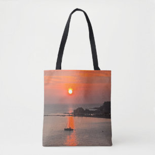 Orange Sunset over Seas Tote Bag