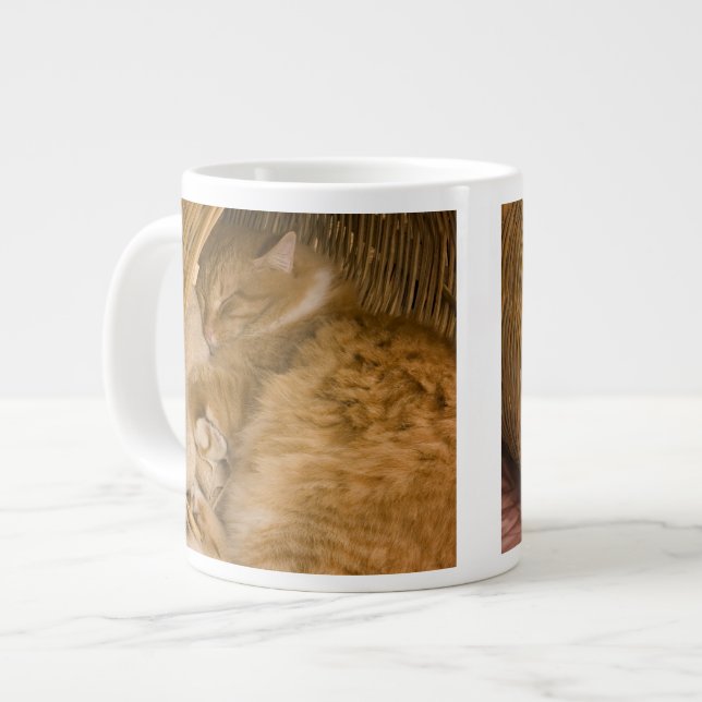 Orange tabby sleeping in hamper large coffee mug (Front Left)