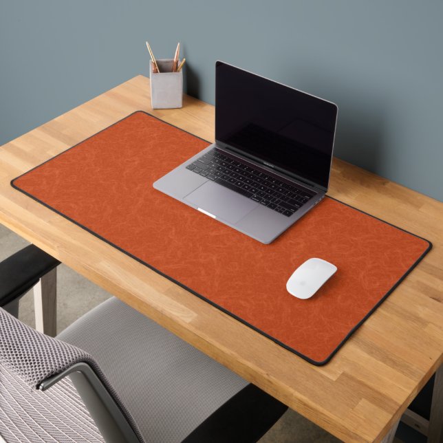 Orange textured surface with swirling pattern desk mat (Office 2)