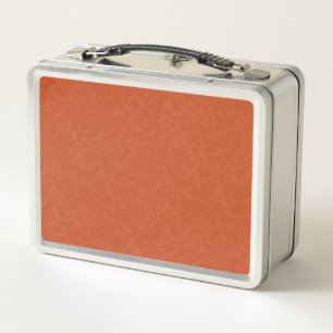 Orange textured surface with swirling pattern metal lunch box