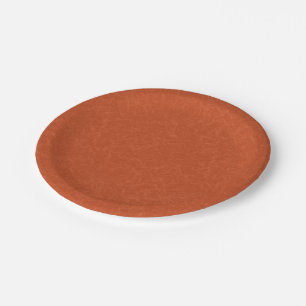 Orange textured surface with swirling pattern paper plate