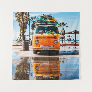 Orange van with surfboard on top tapestry