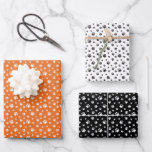 ORANGE WHITE BLACK DOG CAT PET PAW PRINTS WRAPPING PAPER SHEET<br><div class="desc">This adorable wrapping paper for pet lovers features a cute  paw print pattern on a ORANGE,  BLACK and white background. Makes an excellent Christmas or Holiday gift wrap for any dog lover,  cat lover,  cat or dog owner</div>