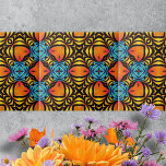Orange Yellow Blue Symmetrical Arrangements Tile<br><div class="desc">This ceramic til features a beautiful pattern that draws the eye into a dance of colour and shape. The intricate design is chraacterised by symmetrical arrangements of vibrant hues, creating an optical illusion effect. The fiery orange shapes, resembling eyes or leaves, are central in the pattern, radiating a sense of...</div>
