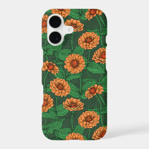 Orange Zinnia flowers, green leaves on dark green