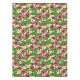Orange Zinnia flowers, green leaves on dark green Tablecloth