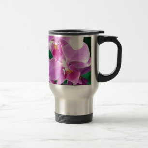 Orchid blooms closeup in pink travel mug