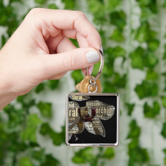 Orchid Floral Blossom Word Cloud over Black Key Ring (Hand)