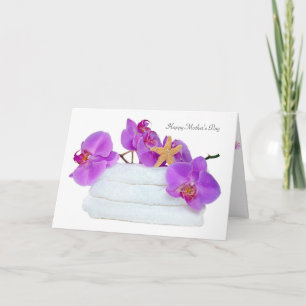 orchids on white towels with starfish for card