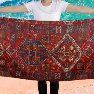 Oriental rug design in red and blue beach towel