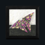 Origami Butterfly on Floral Paper Gift Box<br><div class="desc">Float like a butterfly with this beautiful origami piece by Chariklia Zarris. A lovely floral print paper was used to create the origami butterfly,  and the purples,  yellows,  and greens simply leap off the piece. Buy your copy today!</div>