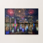 Orlando Florida Skyline with Lake Eola Fireworks Jigsaw Puzzle<br><div class="desc">Light up someone's life with this gorgeous patriotic jigsaw puzzle! The digital design features a dazzling fireworks display over beautiful Lake Eola with its iconic fountain and amphitheater. In the background is the Orlando, Florida skyline. Lake Eola Park in the heart of Downtown Orlando is a popular destination for both...</div>