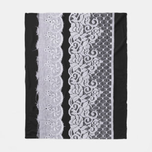 Ornamental white lace, isolated black background. fleece blanket